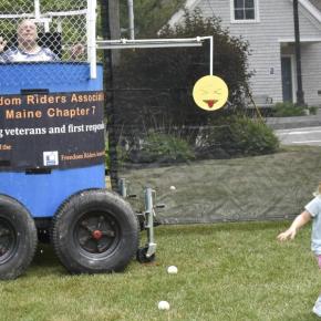 This gleeful wee girl runs back to her family after sinking Marine Corps veteran Charlie Stanley at the BCA's Fourth on the Common July 3. LISA KRISTOFF/Boothbay Register