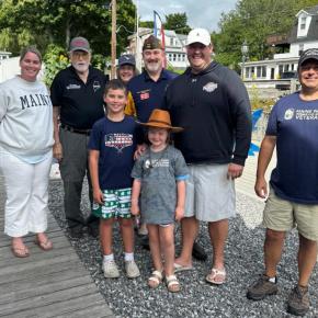 Winners of raffle and members of the VFW. Pictured from left, Megan Gill, Ed Harmon, Kiki, Brad Drummond, Brendan Gill, Justin Morgan; children, Emily and Liam. Courtesy of Jen Mitchell