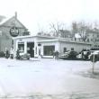 Peanut Lewis' Calso Gas Station in 1953, with the Opera House on the left and Oak Street above