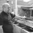 Manager of the Senator Inn Roger Bintliff cooks up lobsters at Fisherman's Wharf on July 20. HILARY RIBONS/Boothbay Register