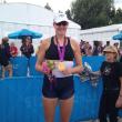 Ellie Logan proudly displays her gold medal. Courtesy of Jaimie Logan