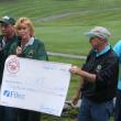 Brenda Blackman presents a check to Special Olympics Maine at the Boothbay Charities Classic Open in 2008. Courtesy of the Boothbay Charities Classic committee