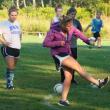 Soccer coach Kate Hossler demonstrates a strong and proper kick to the 17-member Lady Seahawks team at a recent practice.