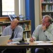 Mark Gorey, left, and Rotarian Bill Bailey listen and take notes during a student presentation. SUE MELLO/Boothbay Register