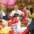 Kelly Flynn, left, and Holly Stover dish out Brown's Wharf first-place chili, made by Micah Jones