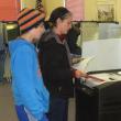 Sarah Goodroe inserts the ballot into the machine as her son Eli watches at the Boothbay Town Office, November 6. 
