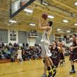 Evan Hepburn slices through two Monmouth defenders. BEN BULKELEY/Boothbay Register