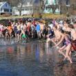 44 hardy souls greet 2012 with a quick, cold dip into Linekin Bay January 1 to raise funds for the YMCA's second grade swim program. The annual fundraiser drew record numbers of plungers and well-wishers to the Murray Hill boat launch on a beautiful, unseasonably warm New Year’s Day. SUE MELLO/Boothbay Register