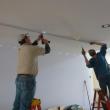 Ron Arsenault, left, and Ted Dowling work to remove the track lighting in Eventide’s expansion. KATRINA CLARK/Boothbay Register