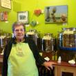 Mim Martin, mother of owner Kim Martin, stands next to her favorite organic tuscan herb infused extra virgin olive oil.