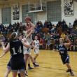 Alex Clarke dodges the Dirigo defense with a spin-around shot in the lane.