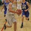Andrew Hallinan drives to the basket on a fast break for two of his 13 points. KEVIN BURNHAM/Boothbay Register