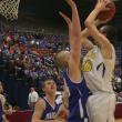 Evan Hepburn shoots over Madison's Steven Lawrence for two points in the second half. KEVIN BURNHAM/Boothbay Register