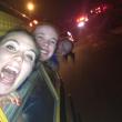 The senior captains Allison Crocker, Alex Clarke and Sarah Caron hang out of the school bus windows while parading through Boothbay Harbor, February 21. Courtesy of Hannah Morley