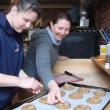 Treats Kitchen Manager Heidi Eastman of Edgecomb, left, and owner Stacy Linehan of Westport Island add crystallized ginger to oven-bound ginger snaps at the Wiscasset business. The store will make heart-shaped snaps for Valentine's Day. SUSAN JOHNS/Wiscasset Newspaper