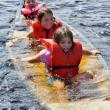 One of Camp Knickerbocker's safety drill exercises: learning to swamp a canoe. Courtesy of Earl Brewer Courtesy of Earl Brewer