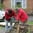 Seth Hedgcock, left, and Tony Curulla cut boards for siding repair at a house on King Phillips Trail. SUE MELLO/Boothbay Register