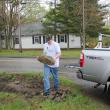 Ben Dewey unloads rocks at Boothbay Green. SUE MELLO/Boothbay Register