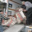 York Fischer, left, and Ted Repa load some stuffed chairs into the truck at the Rocktide Inn on Thursday, May 23. KEVIN BURNHAM/Boothbay Register 