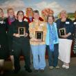 Standing with the winners at the Chamber's annual awards dinner at Fisherman's Wharf May 22 are Pamela Riley, left, president of the Chamber's board of directors, and Catherine Wygant-Fossett, right, executive director. Representing the three award winners are, from left, Elena and Ralph Smith and Boat House Bistro co-owner and chef Karin Guerin of Boothbay Harbor Restaurant Group, winner of the Community Improvement Award; Kim Martin and Mim Martin of Eventide Specialties, winner of the Business Improvemen