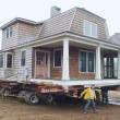 The house formerly owned by George Whitten is propped up on iron beams and hydraulic jacks. Workers from Jewett Builders prepare for the big move. RYAN LEIGHTON/Boothbay Register