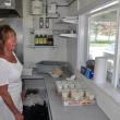 Bet Finocchiaro serves up some fried fish and potatoes May 28 at Bet's Famous Fish Fry in Boothbay. Finocchiaro has been selling just fried fish and potatoes for the last 20 years and said her secret isn't in the sauce but in hard work. BEN BULKELEY/Boothbay Register