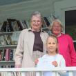  Friends President Jean Dube, left, and volunteer Carolyn Mayne, right, congratulate Hattie Moss, foreground, who won the Used Bookstore’s dove naming contest and a $25 gift certificate to the bookstore. Moss named momma bird “Booksen.”  SUE MELLO/BoothbayRegister.