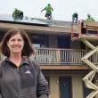 Ann (Robinson) Goggin of Goggin Energy oversees the solar panel installation at Boothbay Harbor's Flagship Inn on June 13. Goggin's solar panels convert direct current from the sun into alternating current right at the solar panel. The panels will offset the Flagship's electricity bill starting July 1.