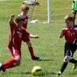 Midcoast United's Wyatt Pinkham gets ready to boot the ball in a game against the Patriots at Clifford Field, Boothbay; team mate Kaleb Ames also pictured in back. SUE MELLO/Boothbay Register