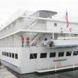 "Independence," an American Cruise Lines ship and frequent visitor to Boothbay Harbor, is tied off by Wotton Wharf’s dock master, Chuck Chaney and Boothbay Region Boatyard’s dock master Amy Armstrong in this September 2012 photo. Independence begins its weekly visits to the harbor this week. LISA KRISTOFF/Boothbay Register