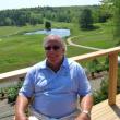 Paul Coulombe sits on the new deck of the clubhouse at the Boothbay Harbor Country Club. JOE GELARDEN/Boothbay Register