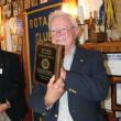 George H. McEvoy holds the Lifetime Service Award plaque he received from the Boothbay Harbor Rotary Club June 13. KEVIN BURNHAM/Boothbay Register