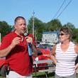 Wiscasset Speedway announcer and promoter Ken Minott, left, and track co-owner Vanessa Jordan address the crowd at a dedication of “Wilford's,” a concession stand named in honor of Wilford Cronk. Cronk  built the track in the 1960s. He died earlier this year. SUSAN JOHNS/Wiscasset Newspaper
