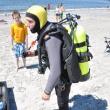 Geared up and ready to dive: Brian Boone, right, stands with almost all 130 pounds of his scuba on at Pemaquid Beach. BEN BULKELEY/Boothbay Register