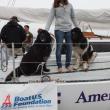 Michelle Levano, a summer intern, poses with Newfoundlands Smudge and Hickory, the furry mascots of the Rozalia Project. RYAN LEIGHTON/Boothbay Register