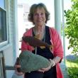 Myrna Snider of East Boothbay proudly holds the alewife sculpture she won at the Fish Ladder Festival. Courtesy of Deb Wilson