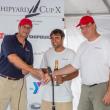 Hodgdon Yachts CEO Tim Hodgdon, left, congratulates representatives from the Scheherezade after the boat won the 2012 Shipyard Cup. Courtesy of Billy Black