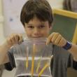Benno Hennig shows his leak proof bag after learning about polymers. Courtesy of Seeds of Knowledge Education Center