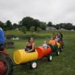 Taking a ride in barrels. KEVIN BURNHAM/Boothbay Register