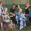 Three of the several volunteer hairdressers work on the locks of three young girls at the Set for Success event. KEVIN BURNHAM/Boothbay Register