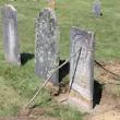 A stone in Kenniston Cemetery is cemented back into place. Courtesy of Merlin Gray