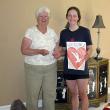 Margaret Perritt presents a check to Kate McPhee. Courtesy of the Boothbay Region Health & Wellness Foundation