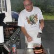 Rotary chef Kim Mills finishes another batch of grilled hot dogs. KEVIN BURNHAM/Boothbay Register