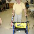 Rotarian Bill Dodge arrives at the Hometown Heroes event with his “personalized” walker. KEVIN BURNHAM/Boothbay Register