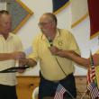 Major Ken Mason of the Lincoln County Sheriff’s Office, is honored by Hometown Heroes organizers Daren and Debbie Graves. KEVIN BURNHAM/Boothbay Register