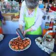 KIM MARTIN prepares her prize-winning lobster bite. SUZI THAYER/Boothbay Register