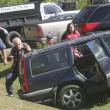 The driver of this Volvo involved in the accident at the Irving gas station walks around the car while being directed to an ambulance by one of the attendants at the scene. KEVIN BURNHAM/Boothbay Register