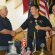 Allan Hitt, left, is honored by Robbie Ham, center, Boothbay Region Ambulance Service director, at the Hometown Heroes event held at the American Legion Hall on September 12. Hitt joined the BRAS in 1976 and retired in 2012. At right is Rotarian Daren Graves, who organizes the annual event with his wife, Debbie. KEVIN BURNHAM/Boothbay Register