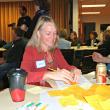 Danielle Betts of East Boothbay writes “the night sky” on a sticky note as a thing of value in our region. KATRINA CLARK/Boothbay Register