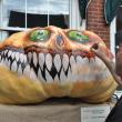 Smile for the camera: Glenn Chadbourne paints his pumpkin in front of King Eider’s Pub in Damariscotta. BEN BULKELEY/Boothbay Register